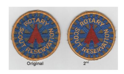 Front.  The original badge was created late 60s to early 70s.  
After original small loom run was exhausted in late 70s the second set was ordered.  Those badges were gone by early eighties. 

